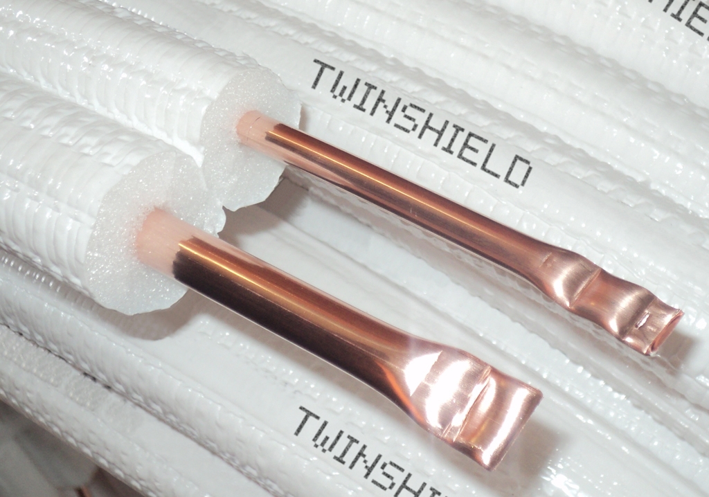 twinshield01-1.jpg Сдвоени медни тръби PDM 6.35 и 9.52х0.80мм. с изолация 9мм 20M (на руло) - Image 1